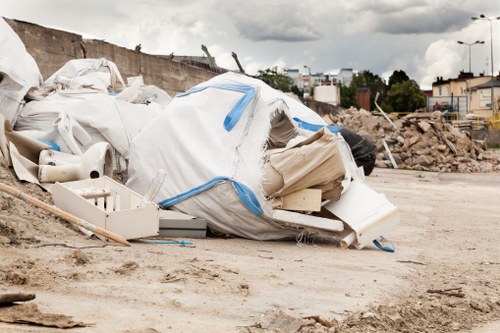 Eco-friendly house clearance team in Notting Hill loading sorted recyclables